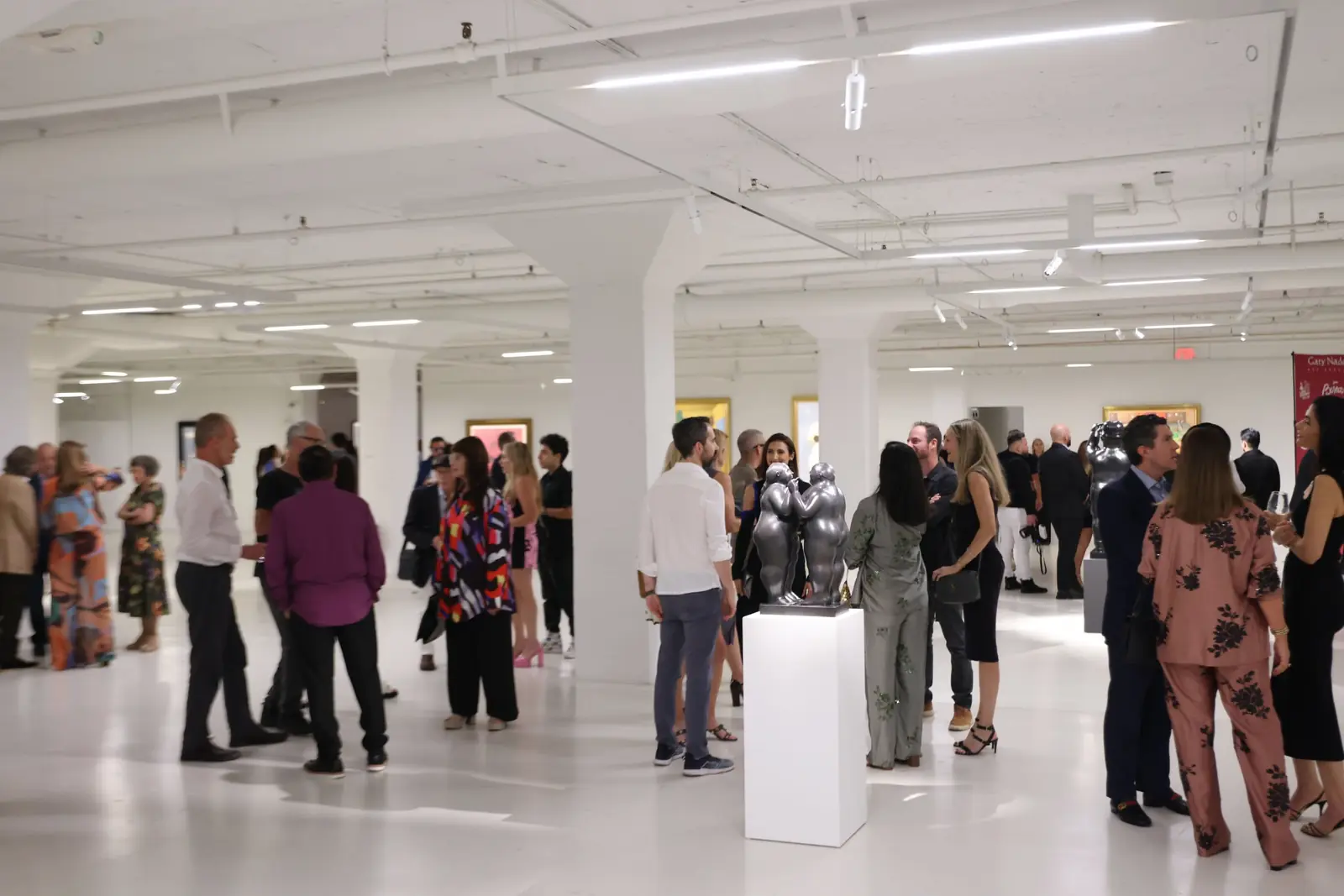 Visitors exploring the Botero & Music exhibition at Gary Nader Art Centre.