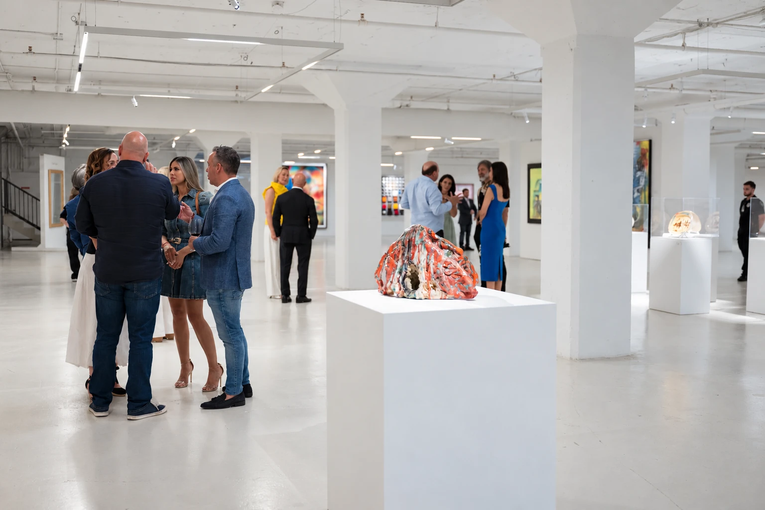 Guests viewing paintings and sculpture during Visual Rhythms at Gary Nader Art Centre.