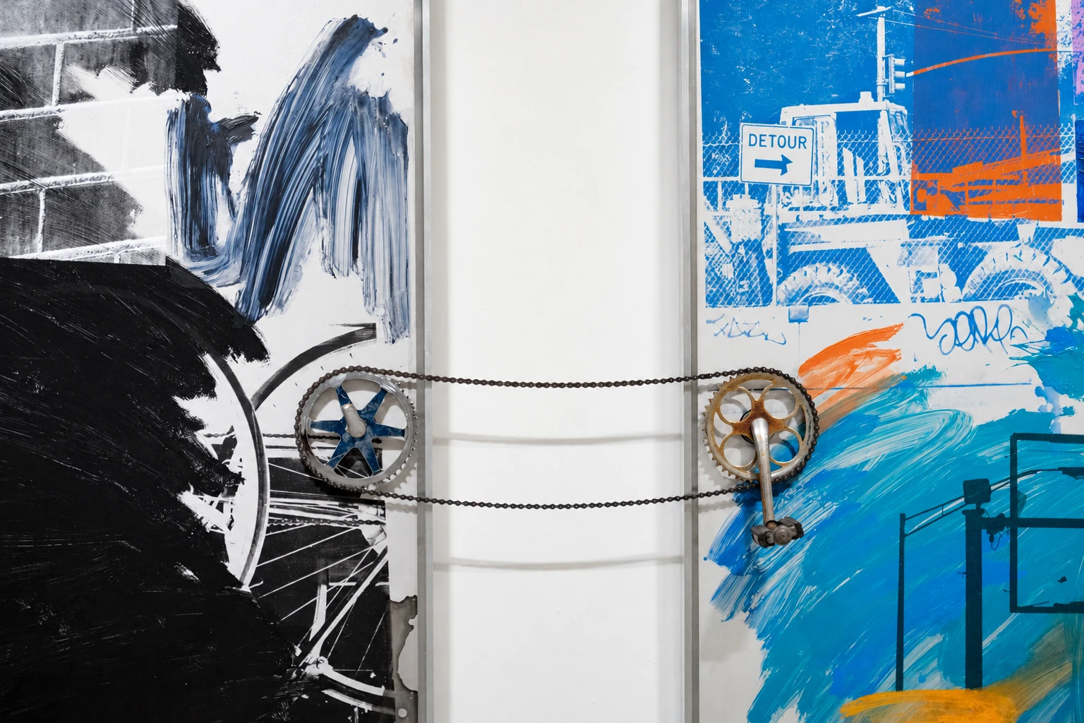 Detail of the chain and bicycle cranks linking two panels in Visual Rhythms.