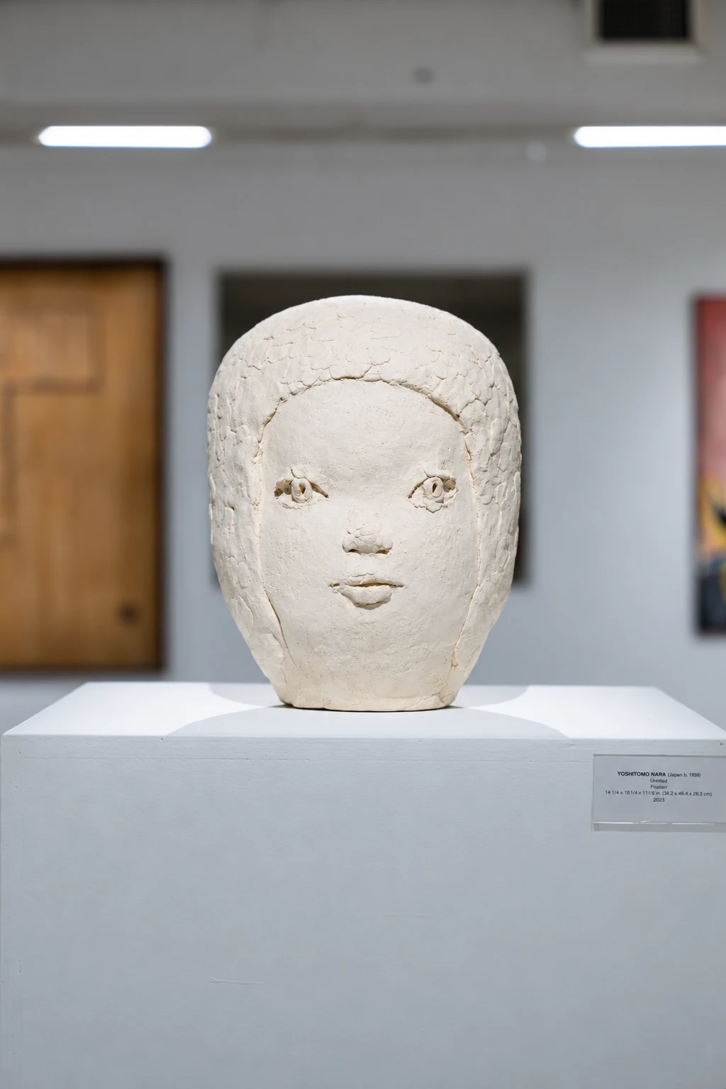 A white sculpted head displayed on a pedestal during Visual Rhythms.
