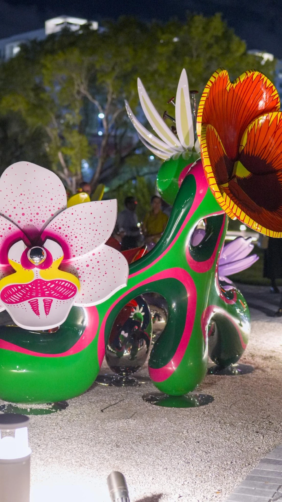 Detail of Chroma Emotiva by Soraya Abu Naba’a, with colorful floral forms and mirrored surfaces at Nader Sculpture Park.