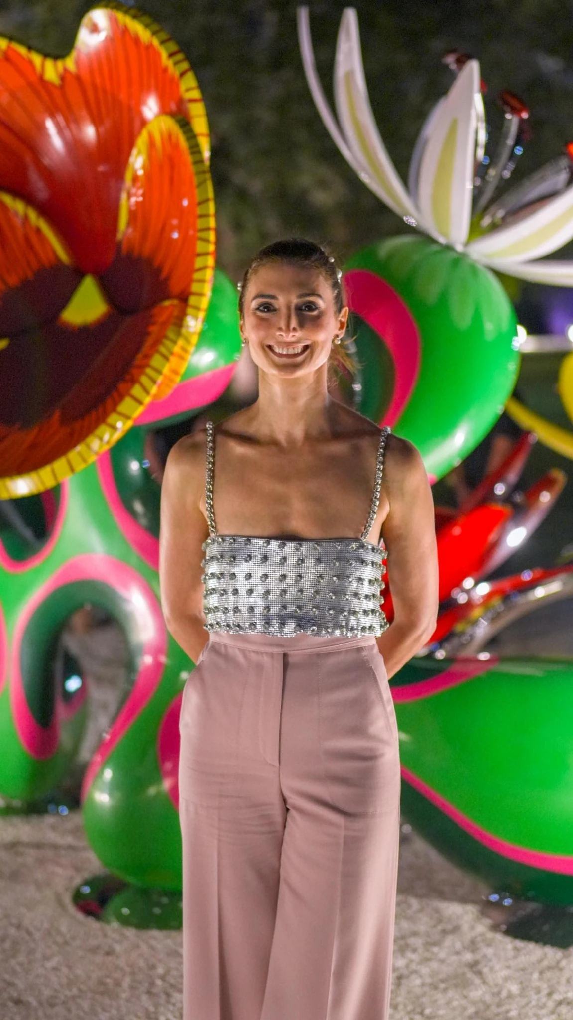 Soraya Abu Naba’a standing in front of Chroma Emotiva during the unveiling at Nader Sculpture Park.