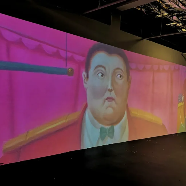 Circus imagery by Fernando Botero projected across the Botero Immersed installation in Miami