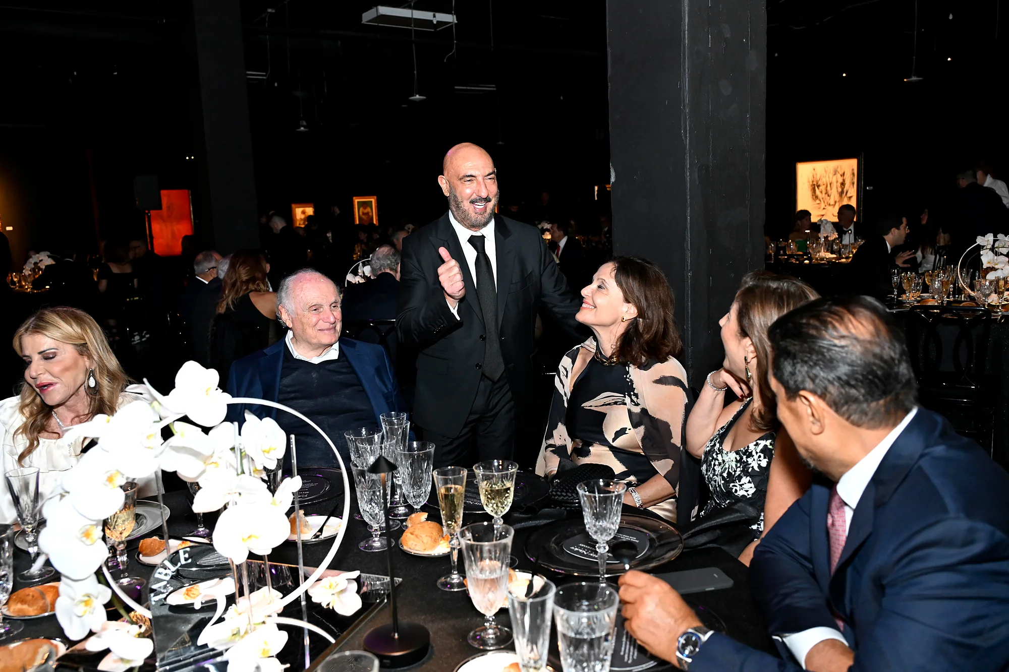 Gary Nader welcoming guests at an anniversary dinner at Gary Nader Art Centre